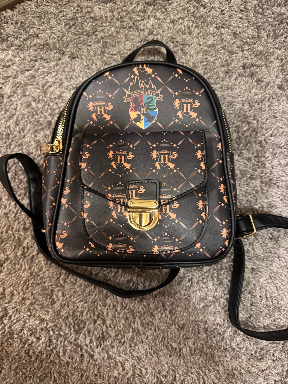Black Mini Backpack with Orange Crest Accents